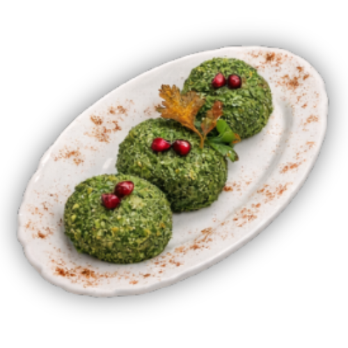 Trys žalio maisto porcijos ant baltos ovalios lėkštės su raudonomis uogomis ir